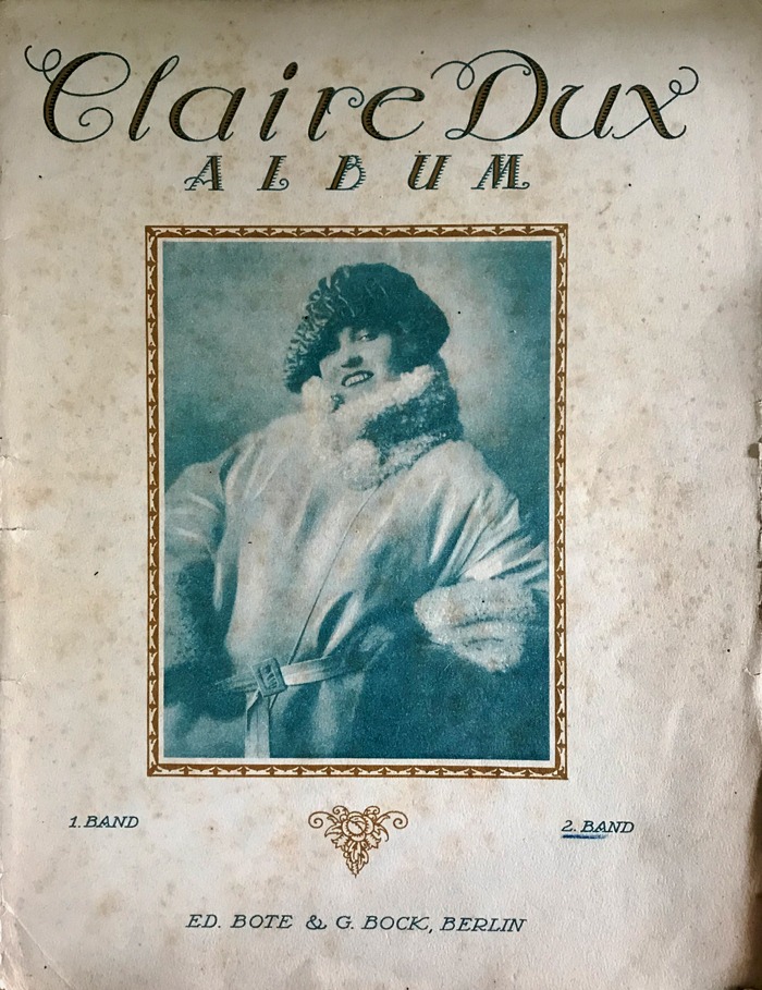 Colour facsimile of the from cover of volume two of the Claire Dux Album (1922)