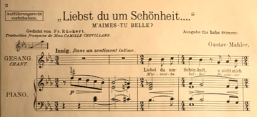 Colour facsimile (reduced) of the first system of the high-voice piano-vocal score of Liebst du um Schnheit, 1910