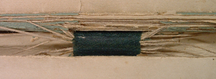 Colour image showing the lower binding tape and threads in volume 1 of Symphony 1, ACF1