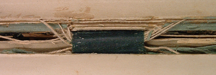 Colour image showing the upper binding tape and threads in volume 1 of Symphony 1, ACF1